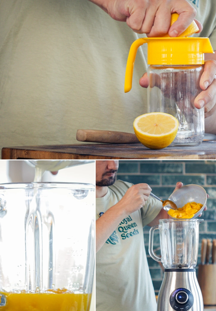 Pouring orange juice, water, and lemon juice into a blender jug with chopped mango to prepare a smoothie.
