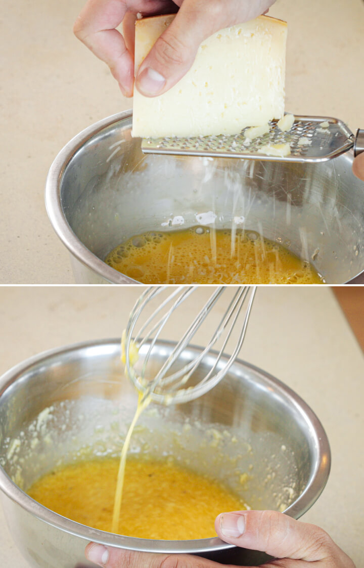 Grating Parmesan into whisked eggs and yolks in a bowl, third step for making cannabis-infused carbonara sauce