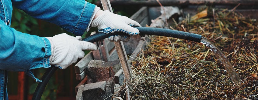 Throwing Water in a Compost Pile