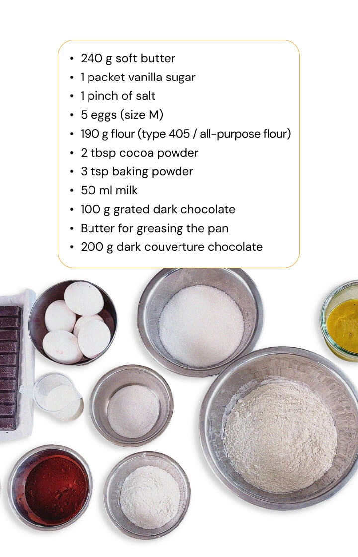 Ingredients for a homemade cannabis space cake recipe with flour, cocoa powder, eggs, butter, milk, and dark chocolate