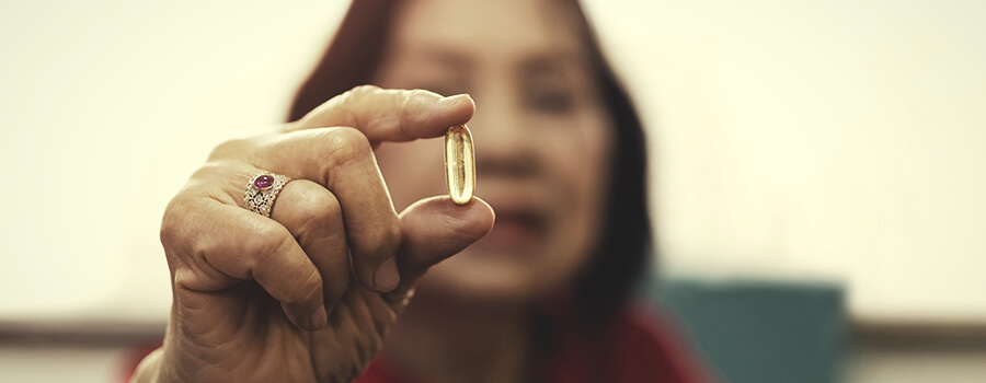 Senior Woman Taking Pill