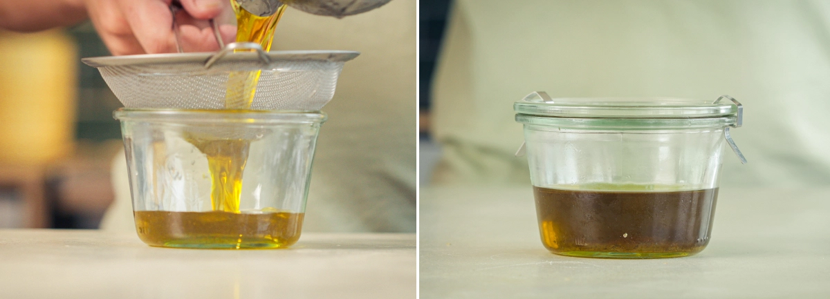 Cannabis-infused olive oil being strained through a fine mesh sieve into a glass container.
