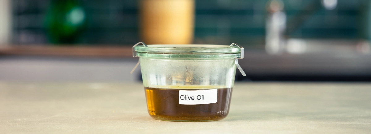 Storing Cannabis-Infused Olive Oil Glass container of cannabis-infused olive oil labeled and ready for storage.