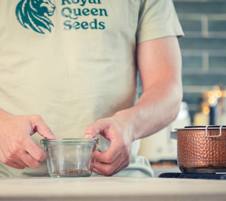 Step 1: Decarboxylate Cannabis for MCT Oil Infusion Preparing dried cannabis in a glass jar before decarboxylation, first step for making cannabis MCT oil