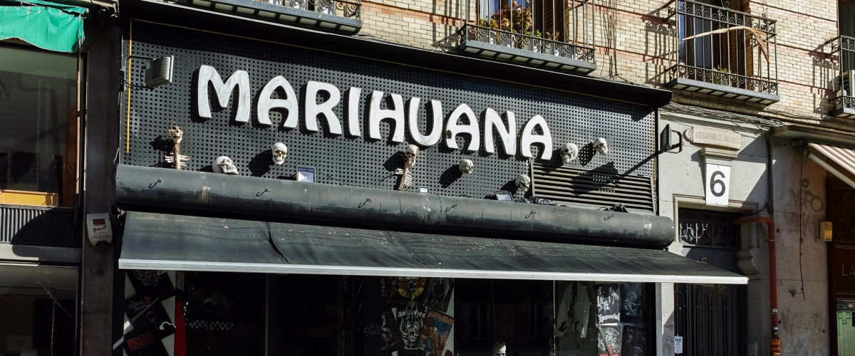 Cannabis Social Club in Spain Storefront of a cannabis social club in Spain with a large marihuana sign above the entrance.