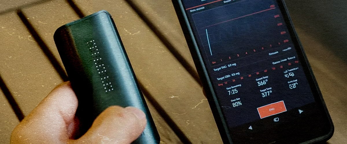 DaVinci IQ3 Vaporizer: Next-Gen Features & Superior Performance PAX IQ3 vaporizer with app showing 80% battery, THC 0.5mg, and 366°F temp, held next to a phone on a wooden table.