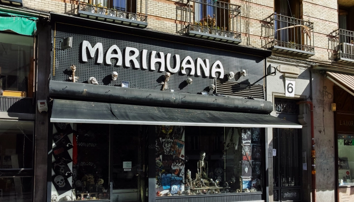 Cannabis Social Club in Spain Storefront of a cannabis social club in Spain with a large marihuana sign above the entrance.